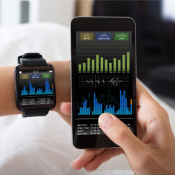 Image of cell phone and smartwatch showing data